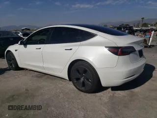 2022 Tesla Model 3 Long Range with VIN 5YJ3E1EB2NF210008, listed as a Copart auction lot 47298585 with 53,753 mi miles and Salvage Title. Bid and sale history available at carsss.com. Image 2.