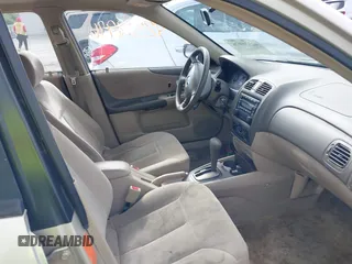 2001 Mazda Protege LX z VIN JM1BJ226210439446, wystawiony jako IAAI lot #42336976 z przebiegiem 155 990 mil mil oraz . Historia ofert i sprzedaży dostępna na DreamBid. Obrazek 5.