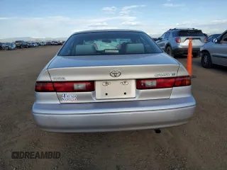 1999 Toyota Camry LE с VIN 4T1BG22K7XU516756, выставлен на аукционе Copart как лот 54065105 с пробегом 176 051 миль миль и Списание • Salvage title. История ставок и продаж доступна на DreamBid. Изображение 6.