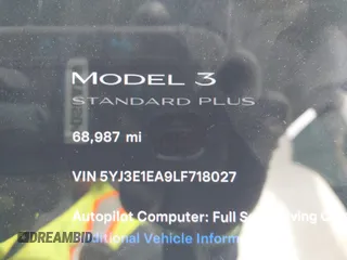 2020 Tesla Model 3 Standard Range Plus with VIN 5YJ3E1EA9LF718027, listed as a IAAI auction lot 41679320 with 68,987 mi miles. Bid and sale history available at carsss.com. Image 15.
