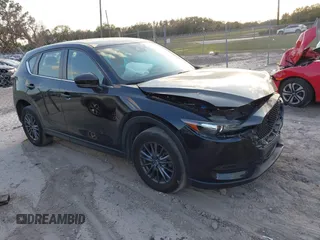 2019 Mazda CX-5 Sport with VIN JM3KFABMXK0693540, listed as a IAAI auction lot 41523569 with 57,895 mi miles and . Bid and sale history available at DreamBid. Image 1.