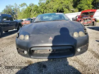 1999 Mitsubishi 3000GT z VIN JA3AM44HXXY002638, wystawiony jako Copart lot #67132454 z przebiegiem 181 684 mil mil oraz Tytuł czysty. Historia ofert i sprzedaży dostępna na DreamBid. Obrazek 5.