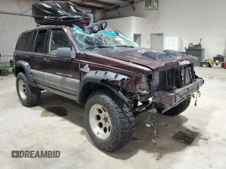 1996 Jeep Grand Cherokee Laredo with VIN 1J4GZ58Y1TC171915, listed as a Copart auction lot 50764034 with 0 mi miles and Salvage Title. Bid and sale history available at carsss.com. Image 4.
