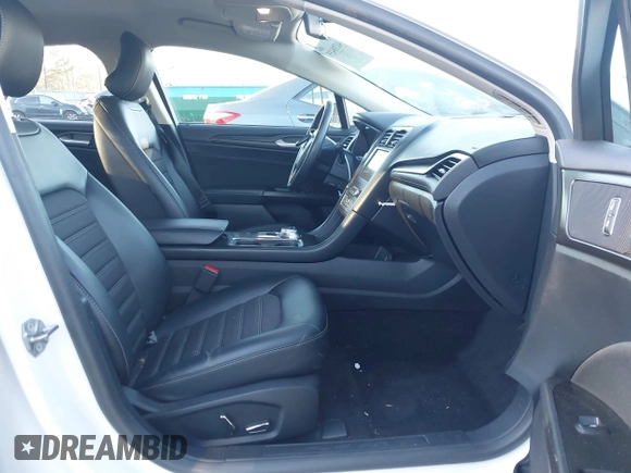 2018 Ford Fusion SE z VIN 3FA6P0H77JR108212, wystawiony jako IAAI lot #41208435 z przebiegiem 68 825 mil mil oraz . Historia ofert i sprzedaży dostępna na DreamBid. Obrazek 5.