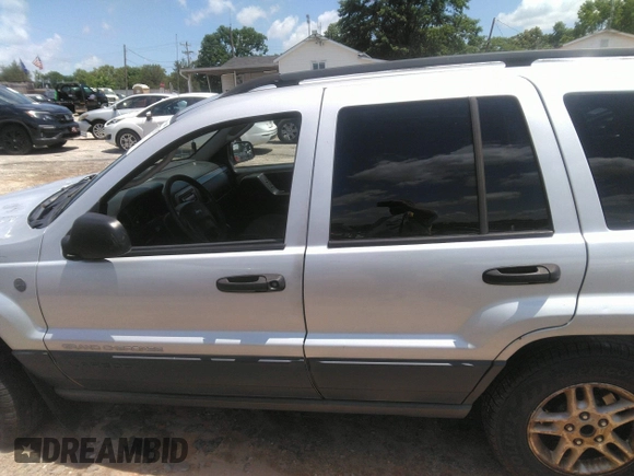 2004 Jeep Grand Cherokee Laredo z VIN 1J4GW48SX4C309998, wystawiony jako IAAI lot #42307167 z przebiegiem 306 912 mil mil oraz . Historia ofert i sprzedaży dostępna na DreamBid. Obrazek 14.