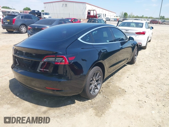 2018 Tesla Model 3 Long Range Battery with VIN 5YJ3E1EB1JF122786, listed as a IAAI auction lot 42010451 with 85,510 mi miles and . Bid and sale history available at DreamBid. Image 4.