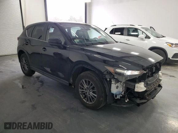 2021 Mazda CX-5 Touring with VIN JM3KFBCMXM0338844, listed as a Copart auction lot 53201615 with 137,498 mi miles and Clean Title. Bid and sale history available at carsss.com. Image 4.