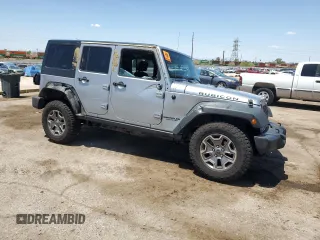 2014 Jeep Wrangler Unlimited Rubicon with VIN 1C4HJWFG1EL241014, listed as a Copart auction lot 63948655 with 165,650 mi miles and Salvage title. Bid and sale history available at DreamBid. Image 4.