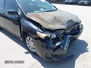 2011 Toyota Corolla L with VIN JTDBU4EE9BJ096586, listed as a IAAI auction lot 41992120 with 201,297 mi miles. Bid and sale history available at carsss.com. Image 6.