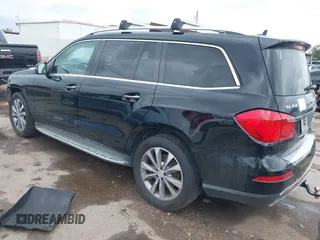 2014 Mercedes-Benz GL 450 with VIN 4JGDF7CE0EA372225, listed as a IAAI auction lot 42141012 with 158,045 mi miles and . Bid and sale history available at DreamBid. Image 3.