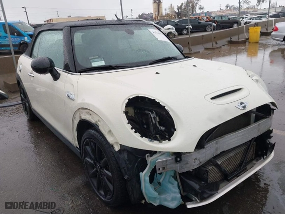 2016 MINI Cooper Convertible S with VIN WMWWG9C52G3C21934, listed as a IAAI auction lot 41569029 with 102,042 mi miles. Bid and sale history available at carsss.com. Image 1.