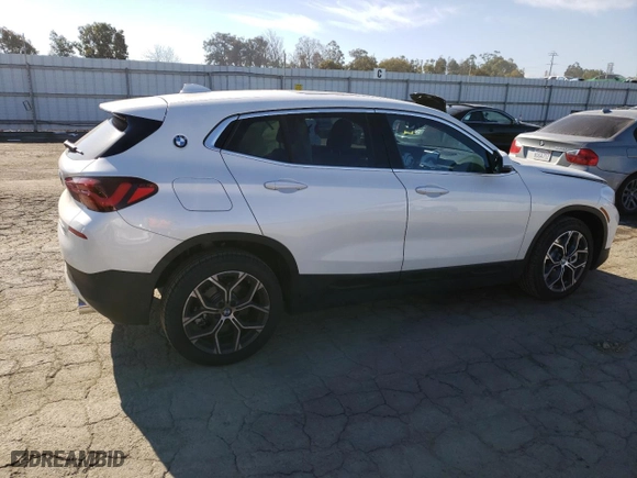2023 BMW X2 sDrive28i with VIN WBXYH9C01P5V56801, listed as a Copart auction lot 37868343 with 2,516 mi miles. Bid and sale history available at carsss.com. Image 3.