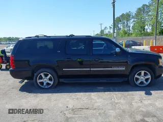 2011 Chevrolet Suburban LTZ with VIN 1GNSCKE01BR275919, listed as a IAAI auction lot 42038399 with 247,841 mi miles. Bid and sale history available at carsss.com. Image 13.