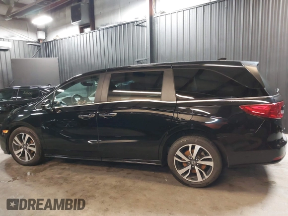2021 Honda Odyssey Touring with VIN 5FNRL6H83MB040138, listed as a IAAI auction lot 39150096 with 61,322 mi miles and . Bid and sale history available at DreamBid. Image 14.