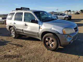2001 Mazda Tribute LX with VIN 4F2CU08111KM20113, listed as a Copart auction lot 87681195 with 144,400 mi miles and Salvage Title. Bid and sale history available at DreamBid. Image 4.