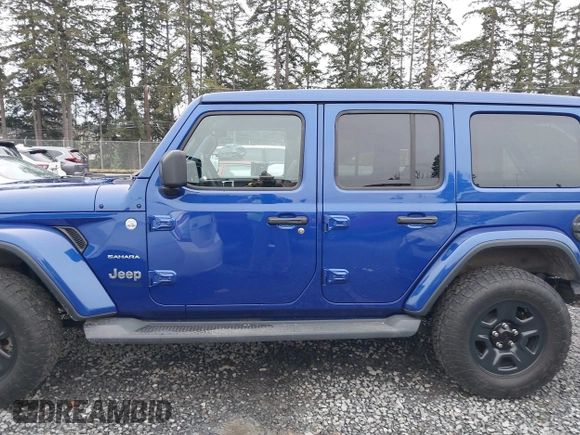2019 Jeep Wrangler Unlimited Sahara with VIN 1C4HJXEG2KW609315, listed as a IAAI auction lot 41144404 with 55,266 mi miles and . Bid and sale history available at DreamBid. Image 14.