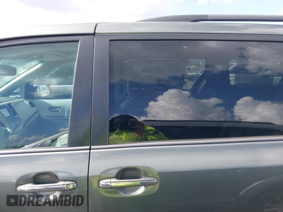 2014 Toyota Sienna XLE with VIN 5TDYK3DC2ES448876, listed as a IAAI auction lot 42519351 with 154,601 mi miles and . Bid and sale history available at DreamBid. Image 14.