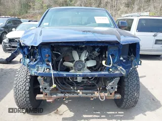 2014 Toyota Tacoma with VIN 3TMLU4EN0EM153558, listed as a IAAI auction lot 41964890 with 140,864 mi miles and . Bid and sale history available at DreamBid. Image 6.