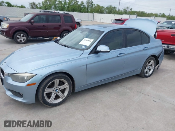 2013 BMW 3 Series 320i with VIN WBA3B1C54DK128284, listed as a IAAI auction lot 40315808 with 136,104 mi miles. Bid and sale history available at carsss.com. Image 2.