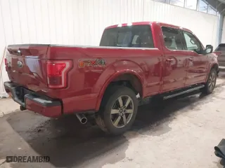 2015 Ford F-150 XLT w/HD Payload Pkg with VIN 1FTFW1EF1FKD80880, listed as a IAAI auction lot 40958352 with 114,911 mi miles. Bid and sale history available at carsss.com. Image 4.