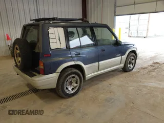 1997 Suzuki Sidekick z VIN JS3TD21V6V4105151, wystawiony jako IAAI lot #41805371 z przebiegiem 126 588 mil mil oraz . Historia ofert i sprzedaży dostępna na DreamBid. Obrazek 4.