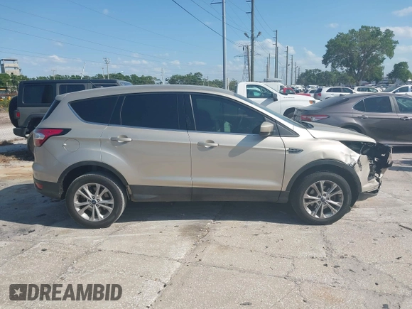 2017 Ford Escape SE z VIN 1FMCU0GD8HUC60074, wystawiony jako IAAI lot #41918443 z przebiegiem 85 787 mil mil oraz . Historia ofert i sprzedaży dostępna na DreamBid. Obrazek 14.