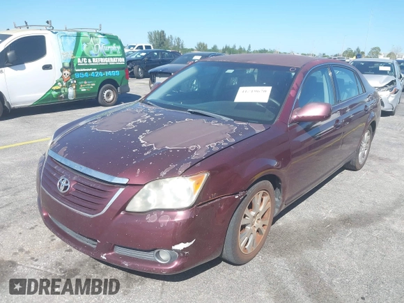 2008 Toyota Avalon XL with VIN 4T1BK36BX8U309181, listed as a IAAI auction lot 41819670 with 227,129 mi miles. Bid and sale history available at carsss.com. Image 6.