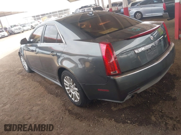 2011 Cadillac CTS Luxury with VIN 1G6DF5EY6B0104932, listed as a IAAI auction lot 42032457 with 165,833 mi miles and . Bid and sale history available at DreamBid. Image 3.