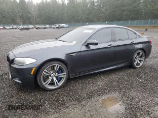 2013 BMW M5 with VIN WBSFV9C51DC774049, listed as a Copart auction lot 49930665 with 76,764 mi miles and Clean Title. Bid and sale history available at carsss.com. Image 1.