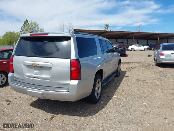 2020 Chevrolet Suburban Premier with VIN 1GNSCJKCXLR219679, listed as a IAAI auction lot 41806579 with 90,132 mi miles. Bid and sale history available at carsss.com. Image 4.