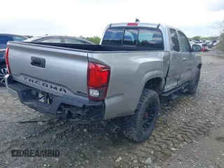 2023 Toyota Tacoma SR with VIN 3TYRX5GNXPT069128, listed as a IAAI auction lot 42007435 with 18,000 mi miles and . Bid and sale history available at DreamBid. Image 4.