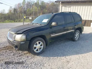 2006 GMC Envoy SLE with VIN 1GKDT13S262204960, listed as a IAAI auction lot 42045236 with 183,338 mi miles. Bid and sale history available at carsss.com. Image 2.