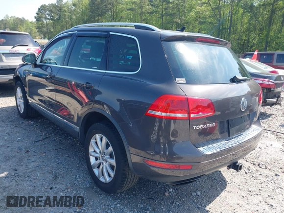 2012 Volkswagen Touareg Sport z VIN WVGEF9BPXCD011020, wystawiony jako IAAI lot #42000763 z przebiegiem 143 470 mil mil oraz . Historia ofert i sprzedaży dostępna na DreamBid. Obrazek 3.