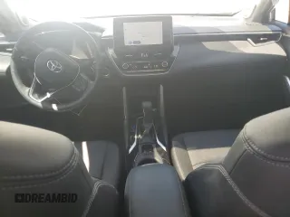 2023 Toyota Corolla Cross XLE with VIN 7MUDAAAG2PV050945, listed as a Copart auction lot 62237465 with 33,036 mi miles and Salvage title. Bid and sale history available at DreamBid. Image 8.