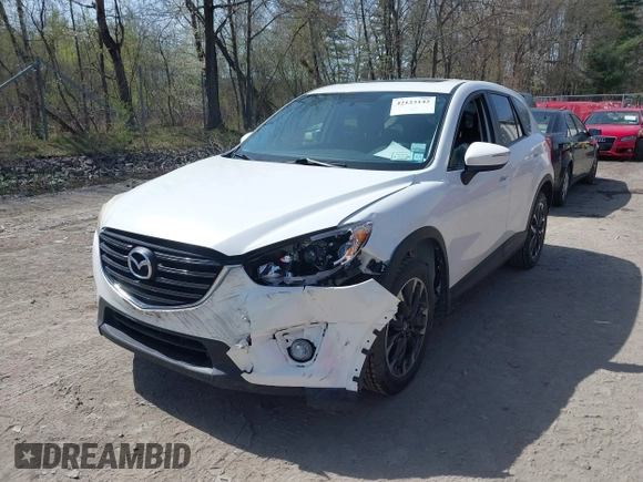 2016 Mazda CX-5 Grand Touring with VIN JM3KE4DY0G0632693, listed as a IAAI auction lot 42123142 with 106,592 mi miles. Bid and sale history available at carsss.com. Image 6.