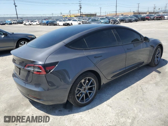 2023 Tesla Model 3 with VIN 5YJ3E1EA8PF616210, listed as a Copart auction lot 49340685 with 38,483 mi miles and Salvage Title. Bid and sale history available at DreamBid. Image 3.