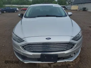 2017 Ford Fusion Hybrid SE z VIN 3FA6P0LU4HR384645, wystawiony jako Copart lot #56454995 z przebiegiem 165 322 mil mil oraz Czysty tytuł • Clean title. Historia ofert i sprzedaży dostępna na DreamBid. Obrazek 5.
