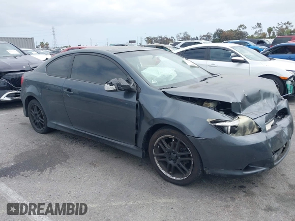 2005 Scion tC with VIN JTKDE177950042663, listed as a IAAI auction lot 42120575 with 255,225 mi miles. Bid and sale history available at carsss.com. Image 1.