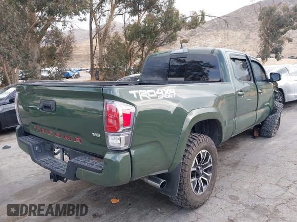 2021 Toyota Tacoma 4WD SR5 with VIN 3TMDZ5BN0MM116198, listed as a IAAI auction lot 41445815 with 59,561 mi miles. Bid and sale history available at carsss.com. Image 4.