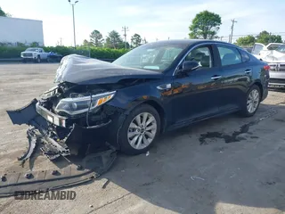 2016 Kia Optima EX with VIN 5XXGU4L3XGG033323, listed as a IAAI auction lot 42088998 with 134,686 mi miles and . Bid and sale history available at carsss.com. Image 2.