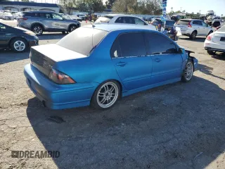 2002 Mitsubishi Lancer OZ-Rally with VIN JA3AJ86E62U070034, listed as a Copart auction lot 86914144 with 180,675 mi miles and Salvage Title. Bid and sale history available at carsss.com. Image 3.