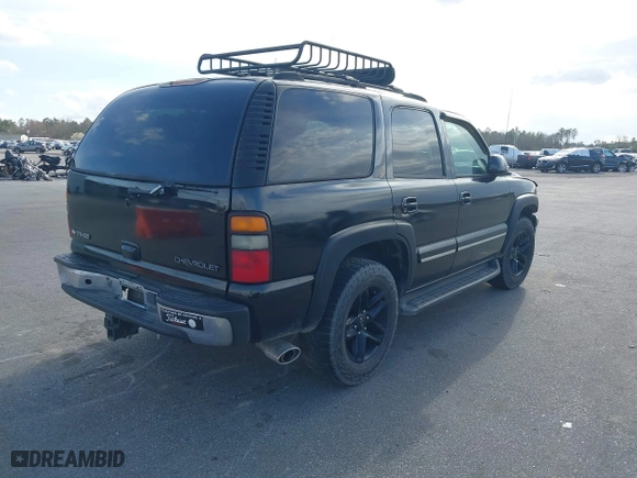 2004 Chevrolet Tahoe LT with VIN 1GNEC13ZX4J106072, listed as a IAAI auction lot 41703828 with 275,081 mi miles. Bid and sale history available at carsss.com. Image 4.