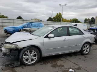 2006 Mazda 6 i with VIN 1YVFP80CX65M55409, listed as a Copart auction lot 76844234 with 143,238 mi miles and Salvage Title. Bid and sale history available at carsss.com. Image 1.