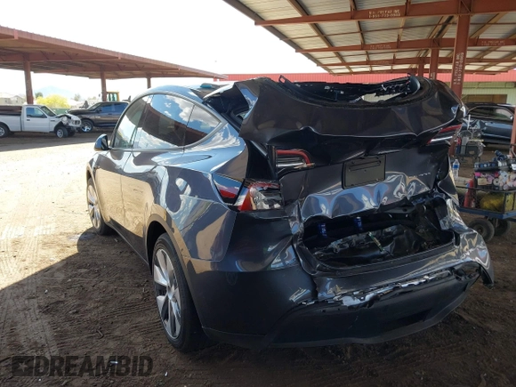 2023 Tesla Model Y Long Range with VIN 7SAYGDEE4PF875915, listed as a IAAI auction lot 42095178 with 11,928 mi miles and . Bid and sale history available at DreamBid. Image 3.