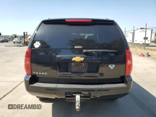 2014 Chevrolet Tahoe LT with VIN 1GNSCBE07ER115998, listed as a Copart auction lot 59577485 with 154,486 mi miles and Salvage title. Bid and sale history available at DreamBid. Image 6.
