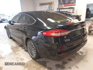 2017 Ford Fusion Titanium с VIN 3FA6P0SU8HR215570, выставлен на аукционе IAAI как лот 41427407 с пробегом 97 281 миль миль и . История ставок и продаж доступна на DreamBid. Изображение 3.