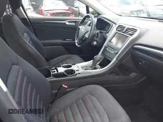 2013 Ford Fusion SE Hybrid z VIN 3FA6P0LUXDR181849, wystawiony jako IAAI lot #41949276 z przebiegiem 112 688 mil mil oraz . Historia ofert i sprzedaży dostępna na DreamBid. Obrazek 5.
