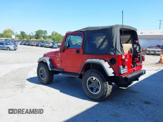 1999 Jeep Wrangler Sport with VIN 1J4FY19S0XP468304, listed as a IAAI auction lot 40038580 with 123,247 mi miles. Bid and sale history available at carsss.com. Image 3.