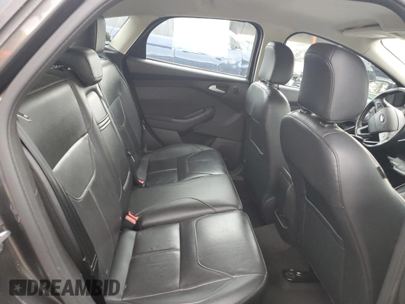 2016 Ford Focus Titanium z VIN 1FADP3N27GL329026, wystawiony jako Copart lot #60910475 z przebiegiem 98 794 mil mil oraz Szkoda całkowita • Salvage title. Historia ofert i sprzedaży dostępna na DreamBid. Obrazek 10.