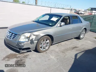 2007 Cadillac DTS Luxury I z VIN 1G6KD57Y97U198072, wystawiony jako IAAI lot #42315865 z przebiegiem 141 272 mil mil oraz . Historia ofert i sprzedaży dostępna na DreamBid. Obrazek 6.